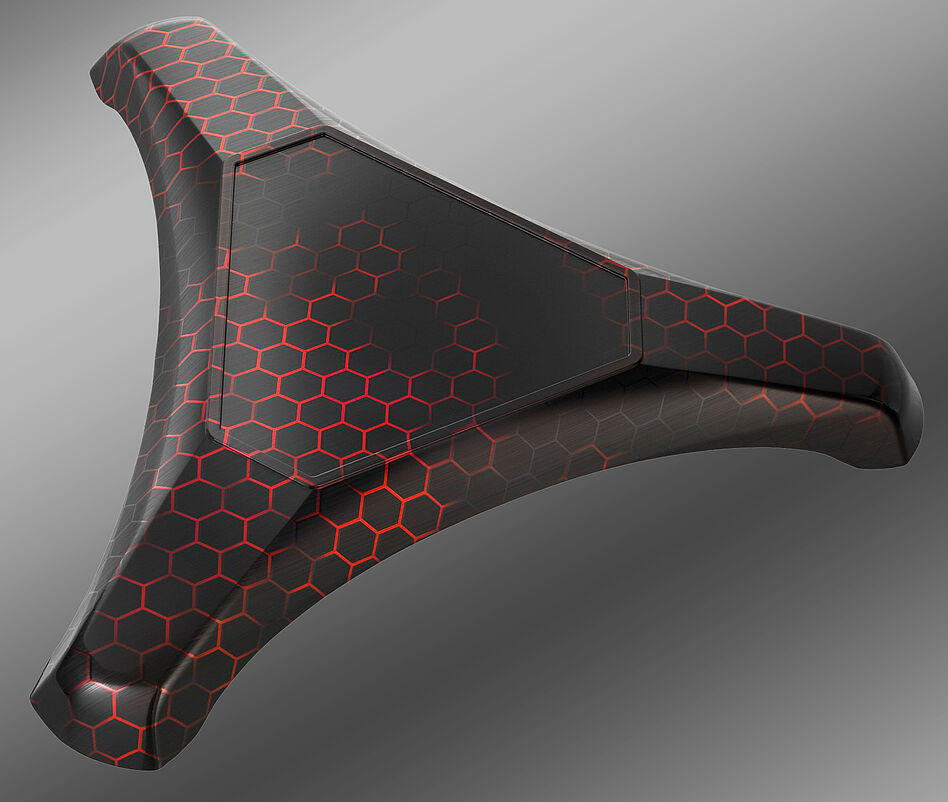 Spritzguss Kunststoffteil in Triangel-Form schwarz mit roter Strukturoberfläche in Wabenform